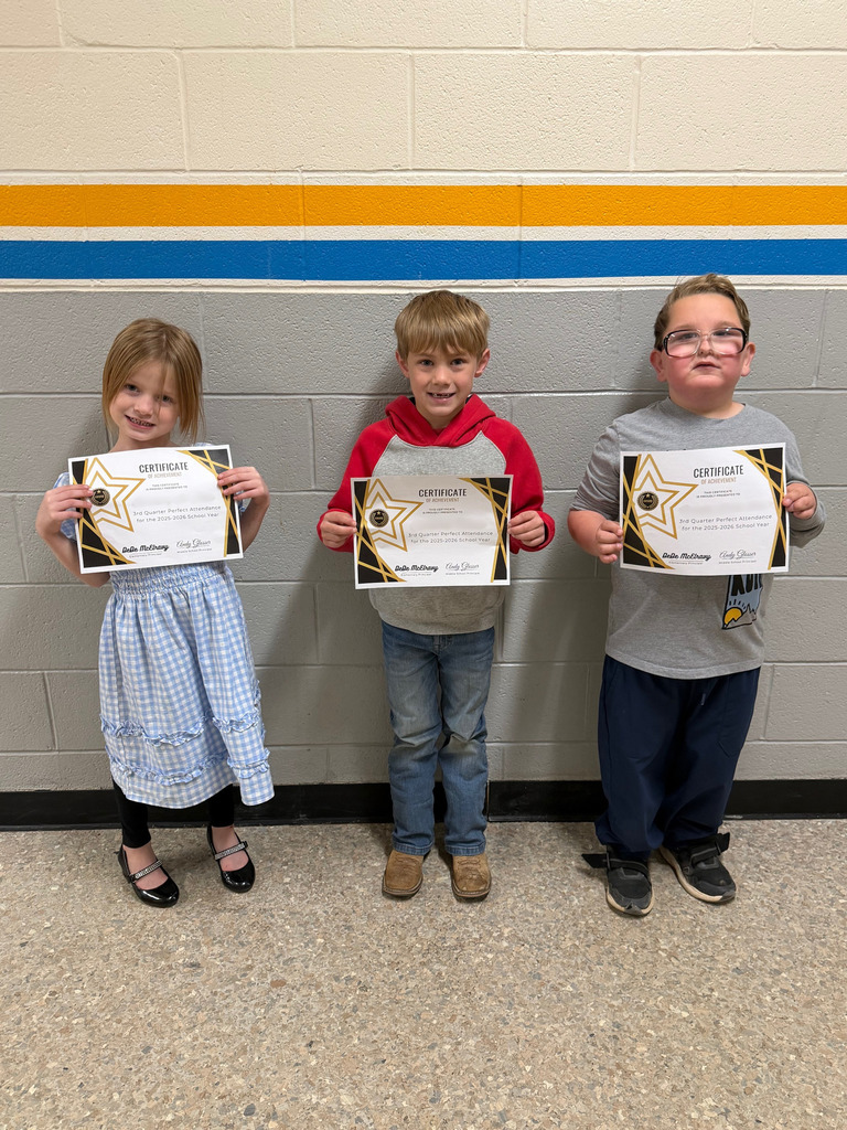 Pictured are three students holding their perfect attendance certificates.