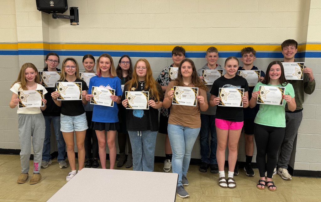 Pictured is one of the groups. The students are holding their certificates. 