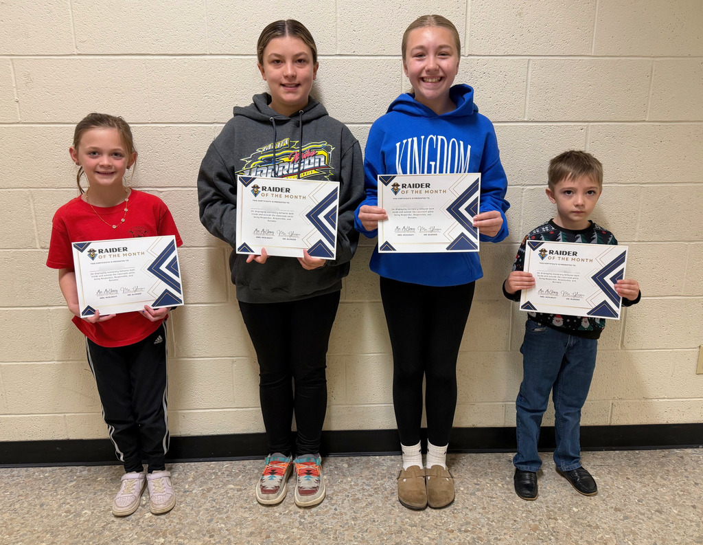 Pictured are the four Raiders of the Month. They are holding their certificates.