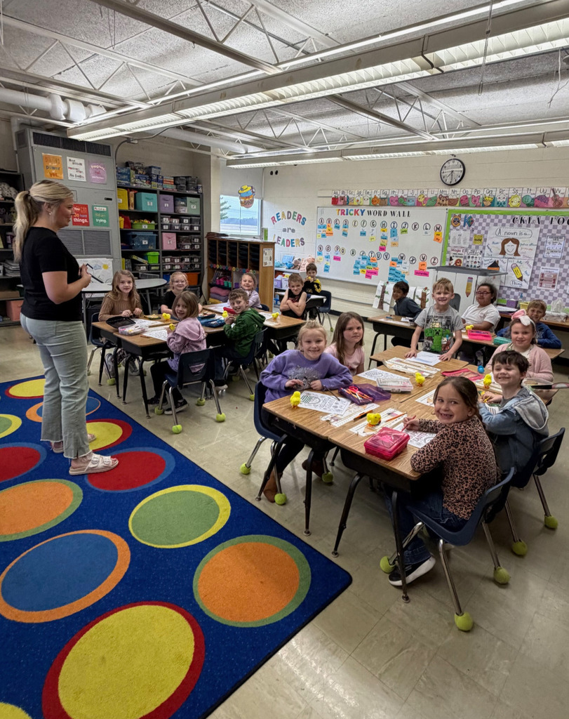 Students are taking a made up spelling test with their "new" teacher.