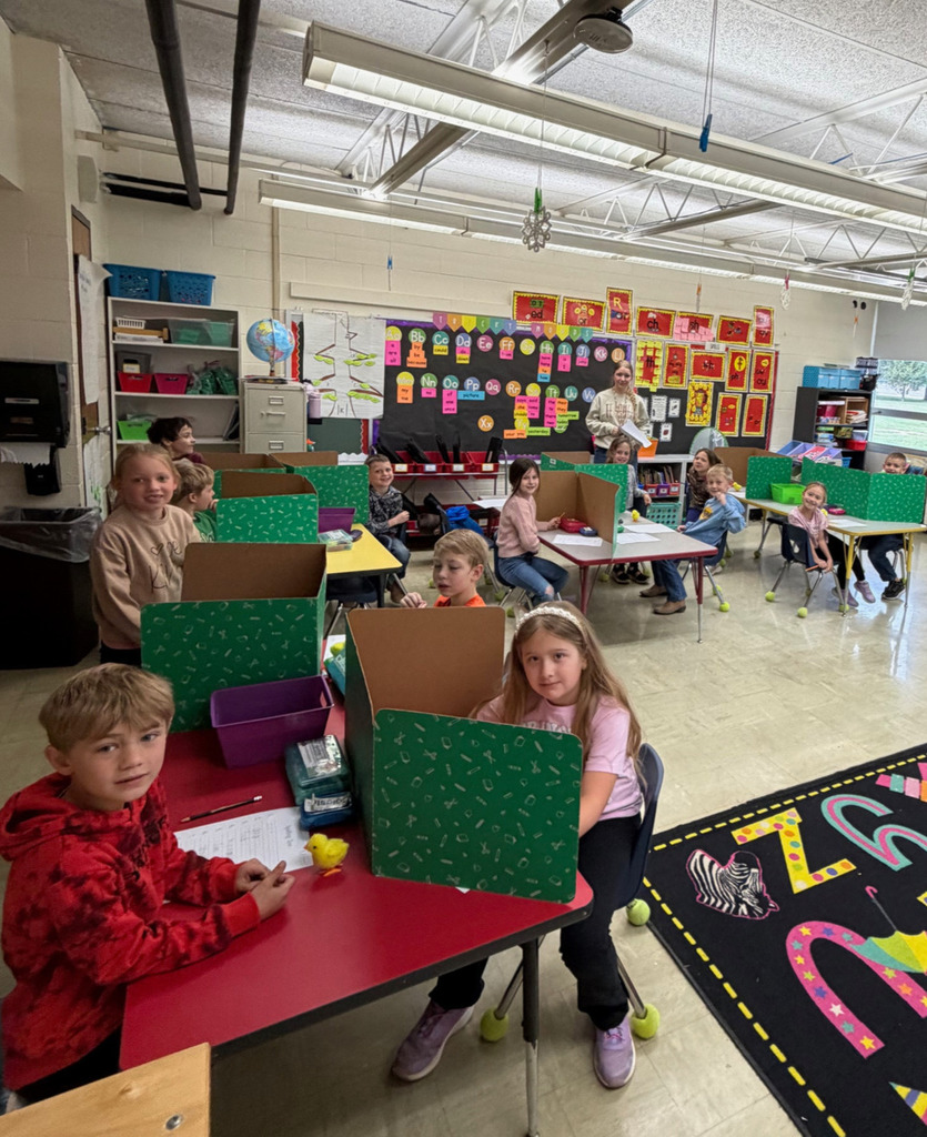 Students are taking a made up spelling test with their "new" teacher.
