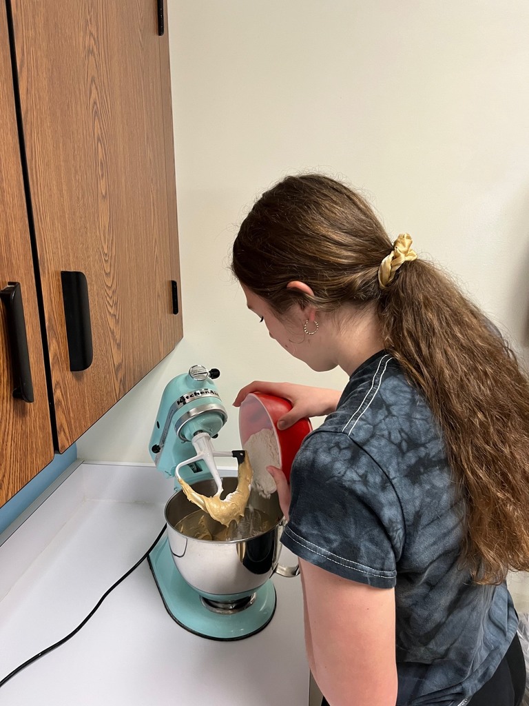 A student is mixing the batter.