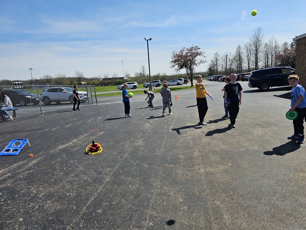 A group of students are tossing a ball for their activity. 