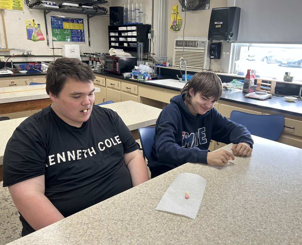 Students have a small piece of something in their mouths that makes it look like they are breathing steam.