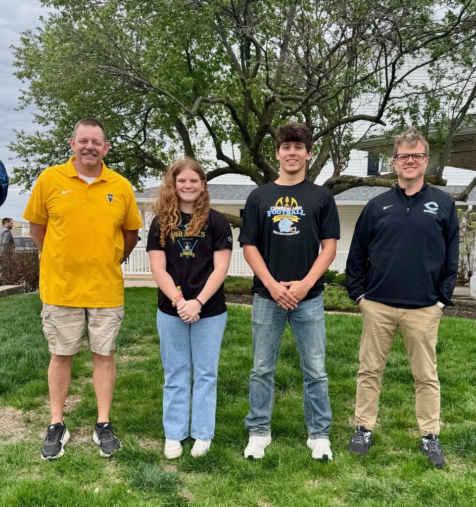 Pictured are the two students and two administrators.