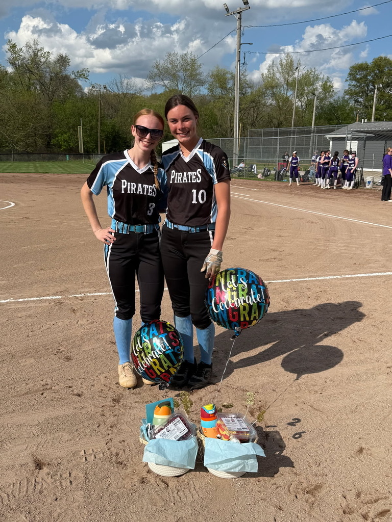 Pictured are the two seniors with their gift baskets and balloons. 