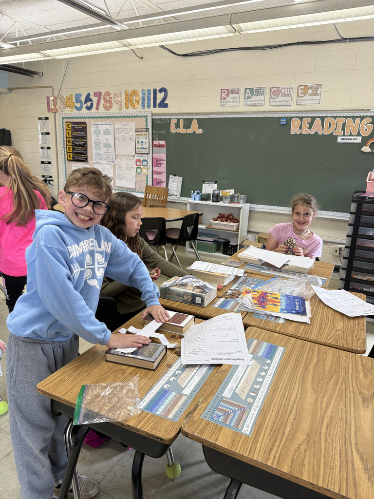 Three students are building their bridges. 