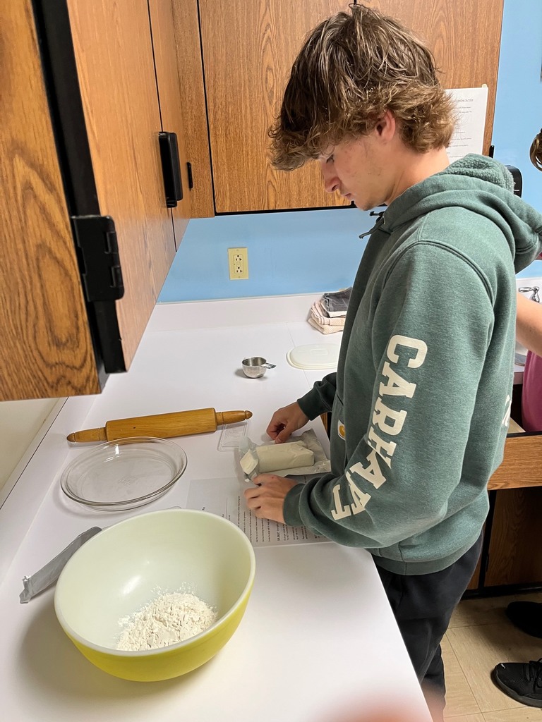 A student is cutting sour cream. 