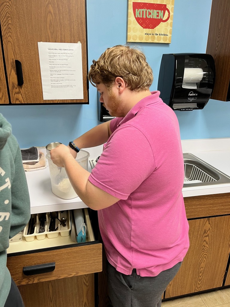 A student is measuring flour. 