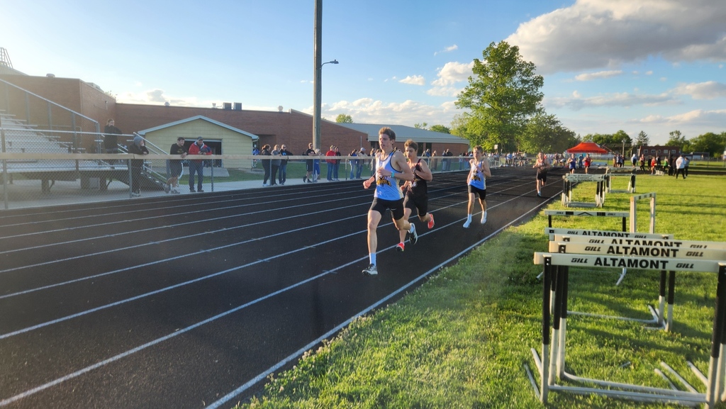 Three runners in the mile are leading the pack. Cumberland is in first and third. 
