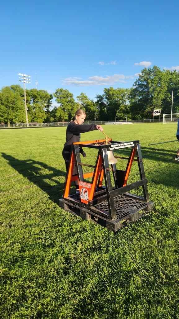 An athlete is ringing the bell. 