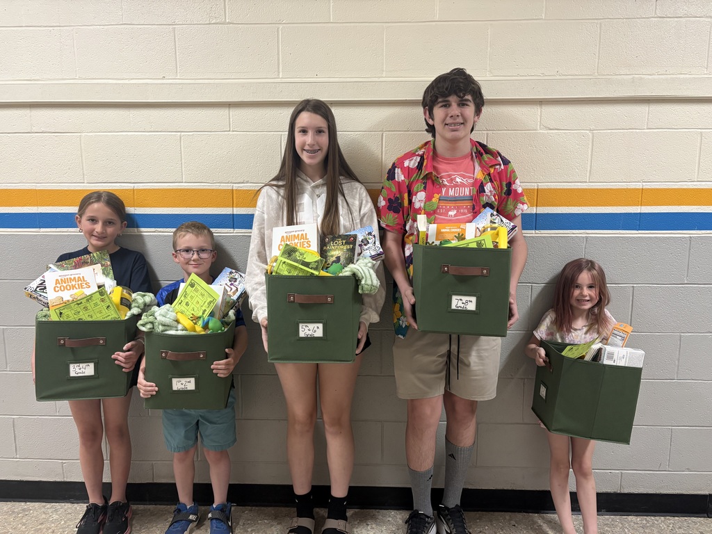 Pictured are five students who won a basket of goodies after completing the scavenger hunt during Themes Night. 