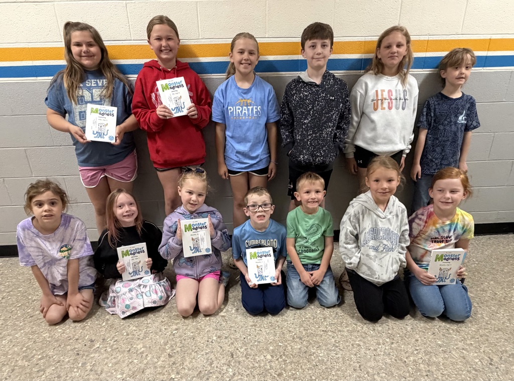 13 students are pictured. They are the students whose artwork was selected for the publication. 