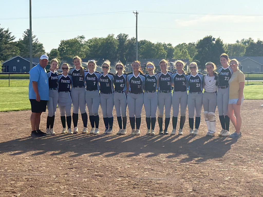 Pictured is the team flanked by both coaches.