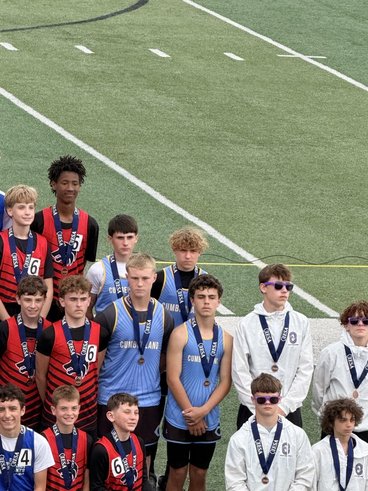 The 4x100 team on the podium with their medals.