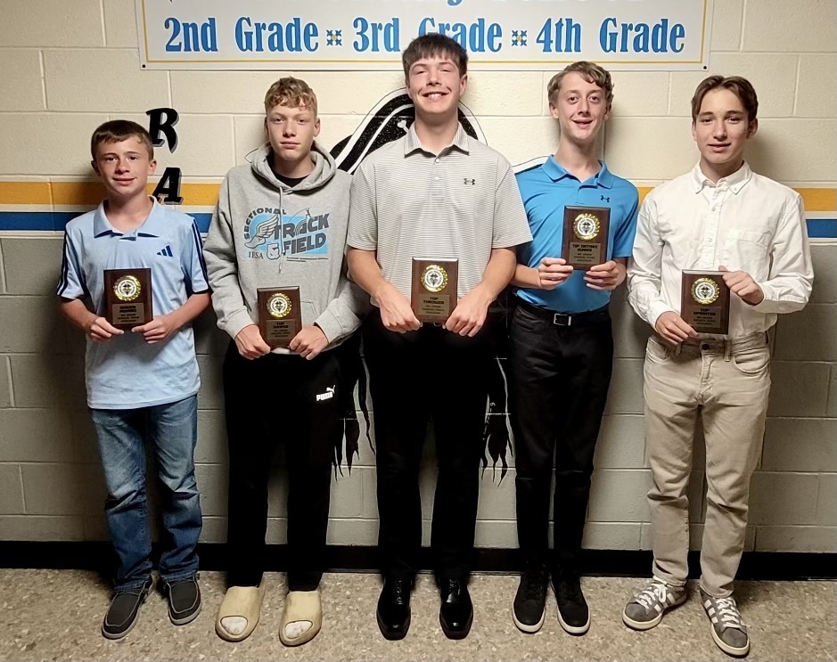 8th Grade Boys winners with plaques. 