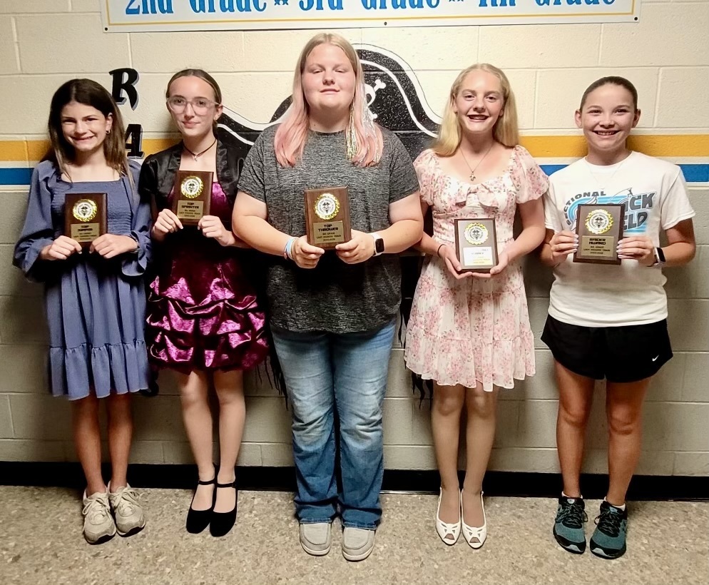 8th Grade Girls winners with plaques. 