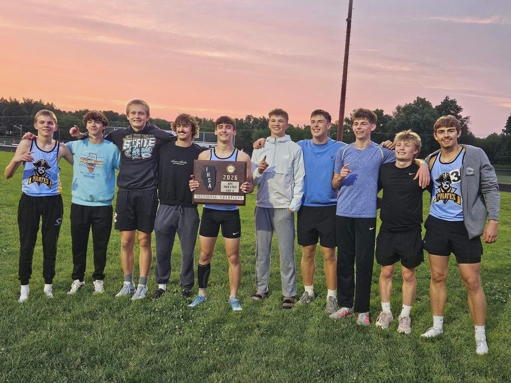 Pictured are the 10 state qualifiers. They are holding the sectional plaque. Some are holding a number 1 up. 