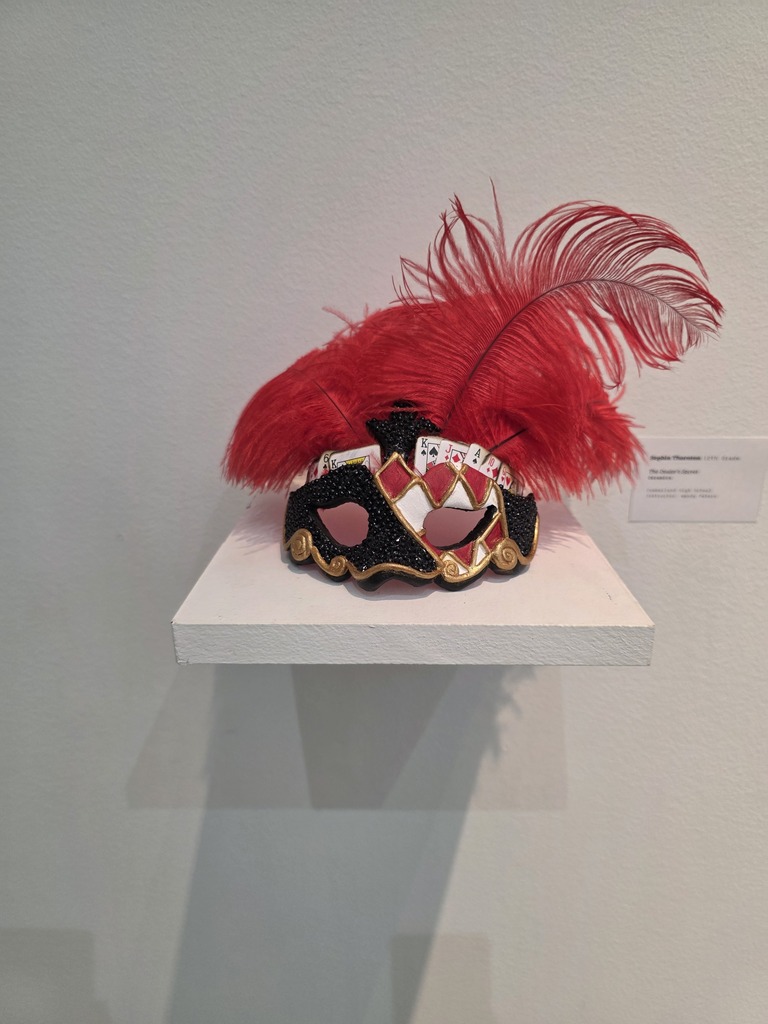 An artwork piece is pictured. It is a mask. 
