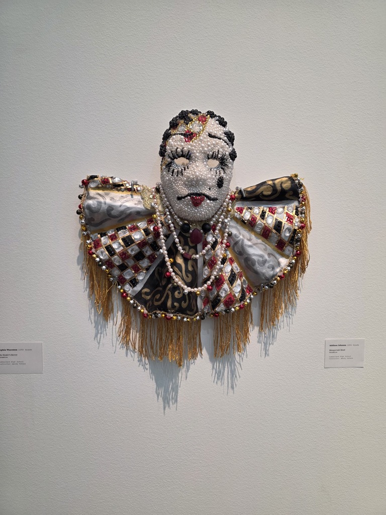 An artwork piece is pictured. It is a mask. 