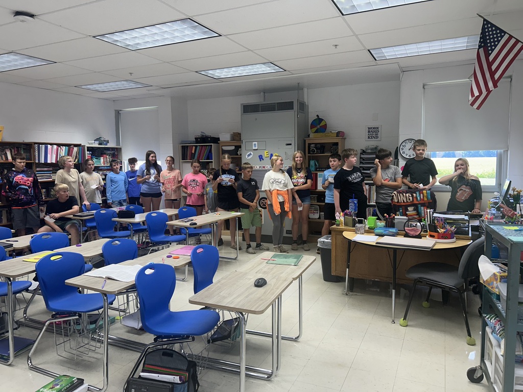 Students are lined up around the room in the order of the events in the story.
