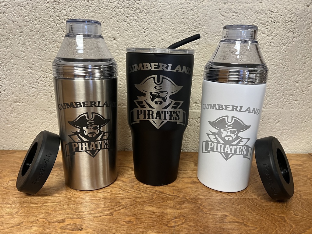 Three examples of engraved cups are pictured. One is silver, one is black, and one is white.