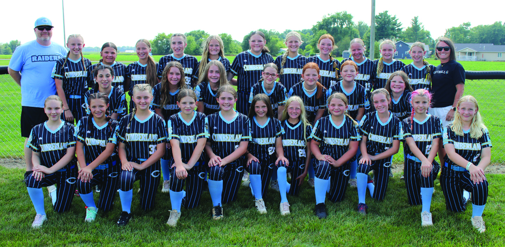 There are three rows of players for a total of 29 players. There are two coaches flanking the rows, 
