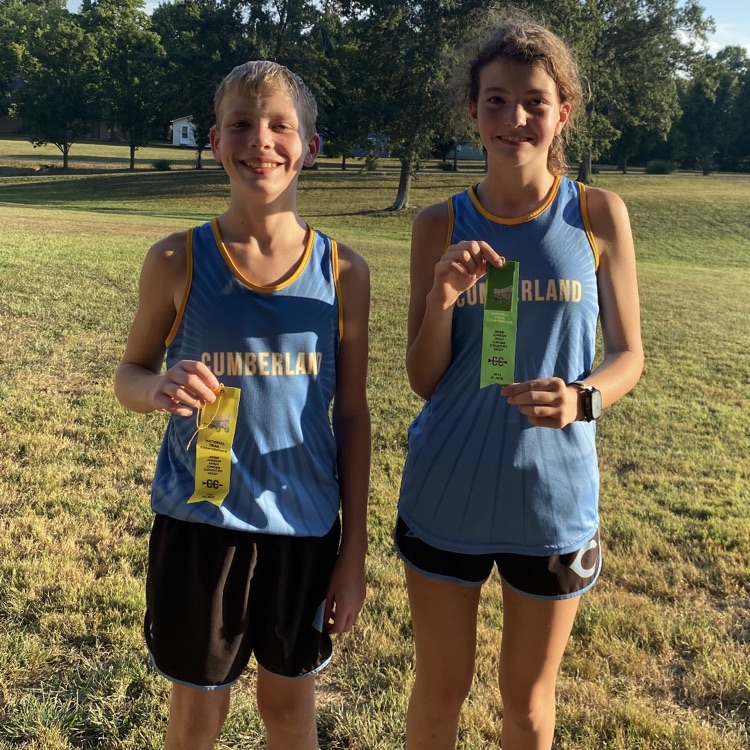 Pictured are the two runners. Each is holding their ribbon  