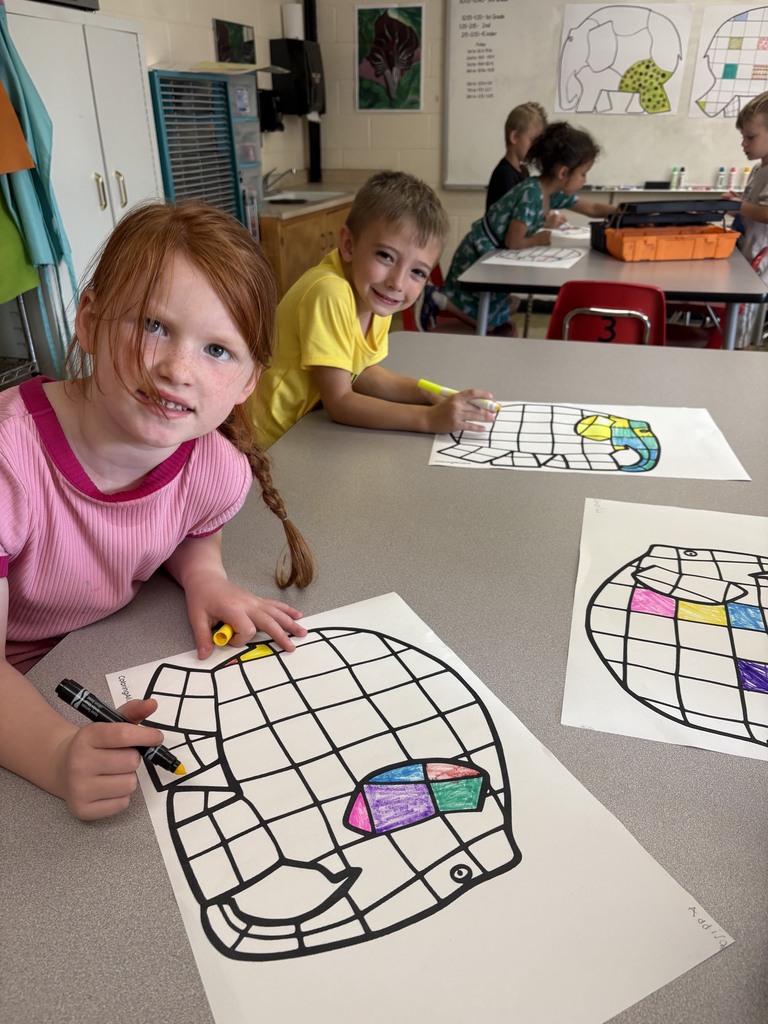 Two students are coloring a checkered elephant. 