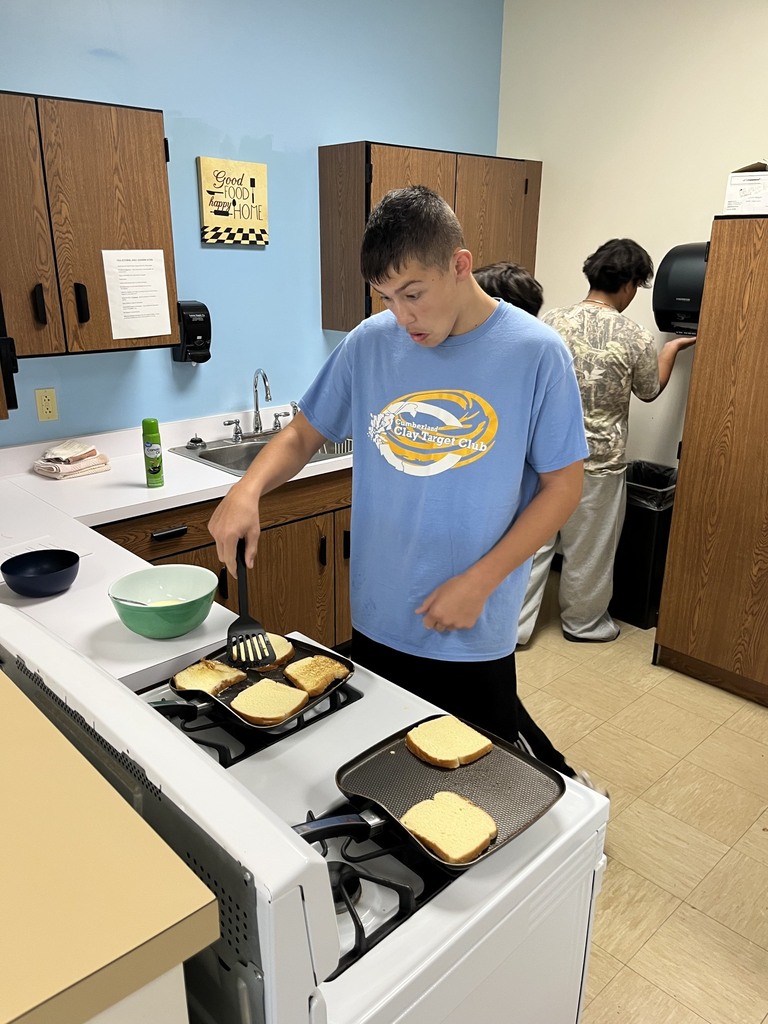 A student is flipping their French Toast.