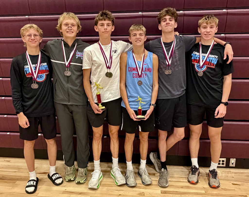Pictured are six of the seven medalists wearing thir medals.