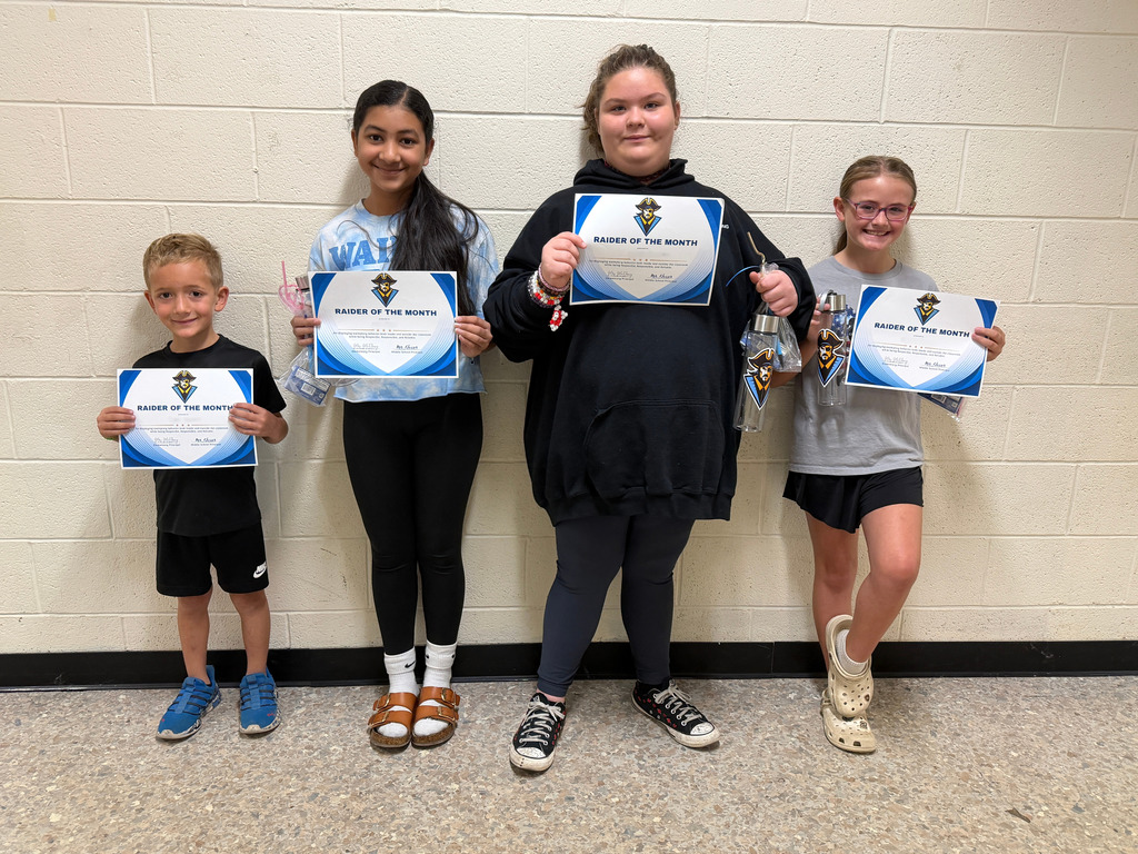 Pictured are th four Raiders of the Month holding their certificates. 