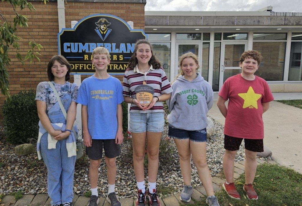 Pictured are the five members of the team with their plaque.