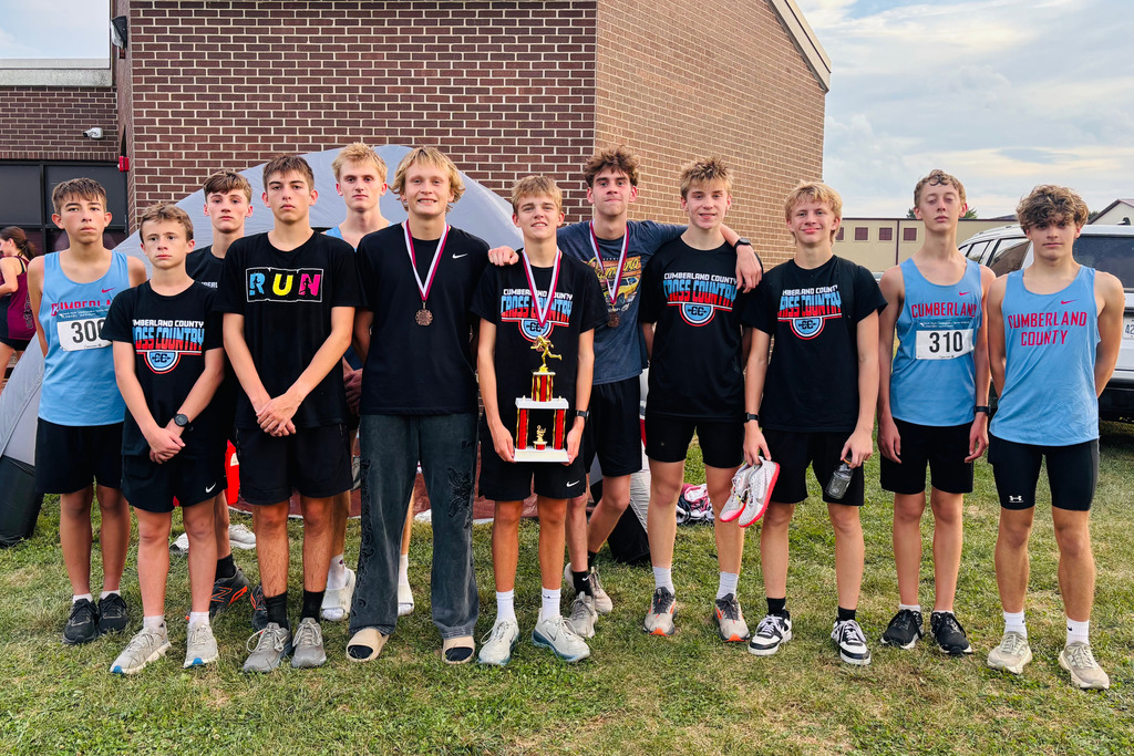 Pictured is teh boys team with their team trophy. Medalists are wearing their medals.