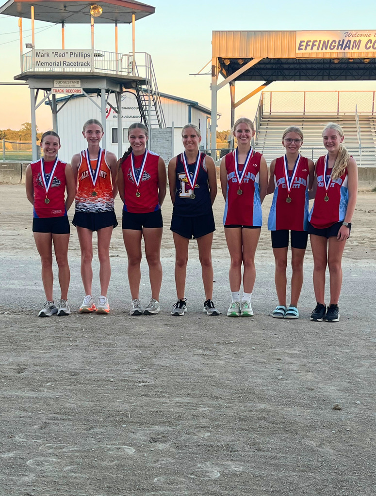 Pictured are the girls all conference runners each wearing their medal.