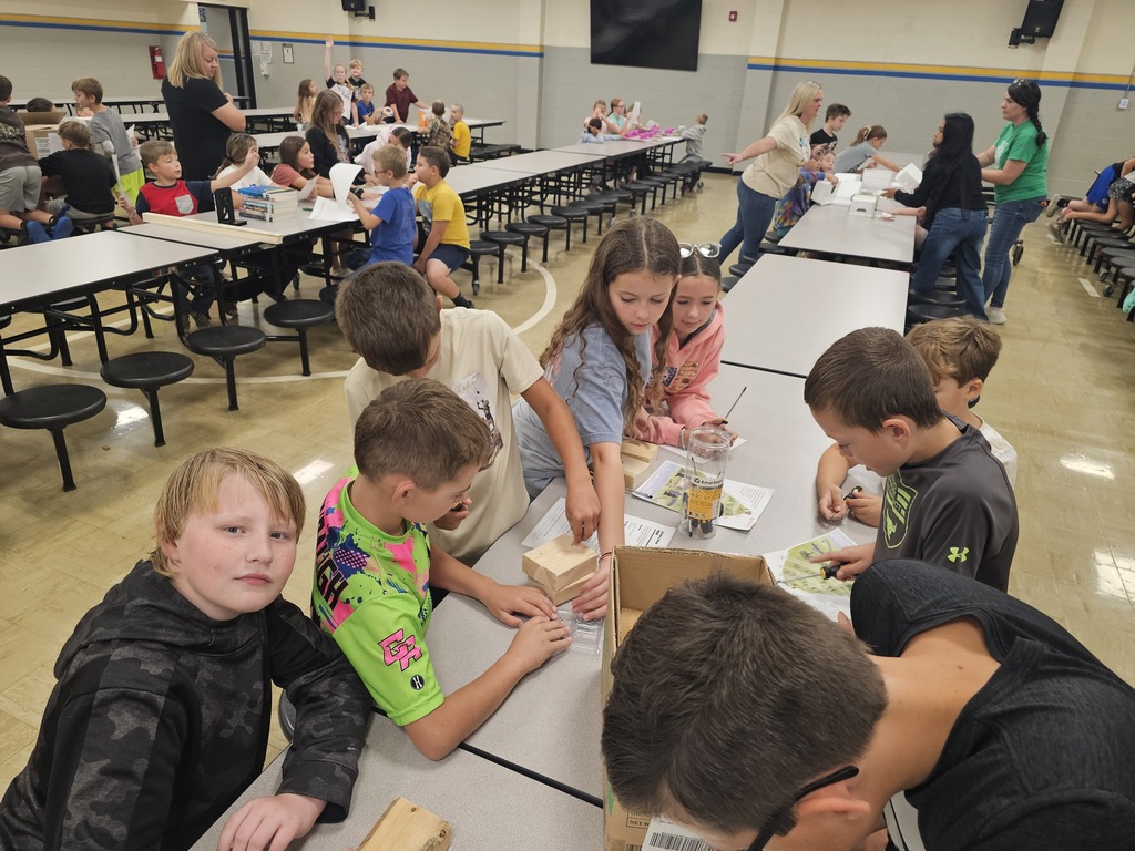 Students are using a screwdriver and a screw to learn about the simple machine. 
