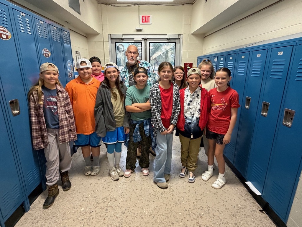 Eleven students are dressed like Adam Sandler. 