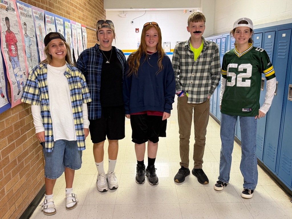 Five students are dressed like Adam Sandler. 