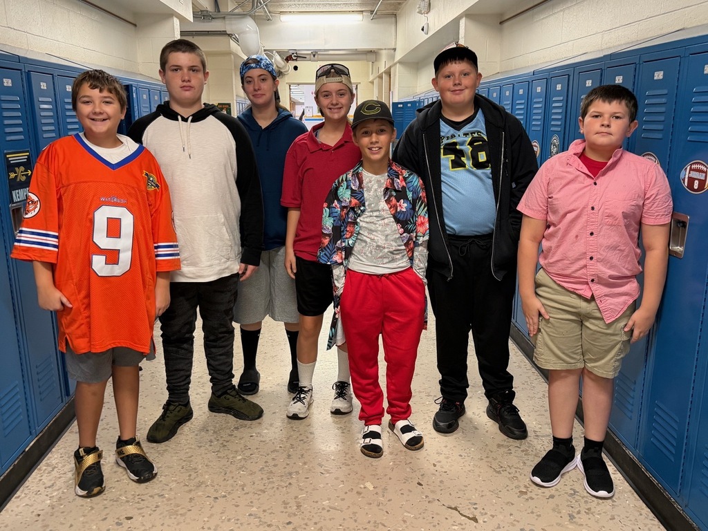 Seven students are dressed like Adam Sandler. 