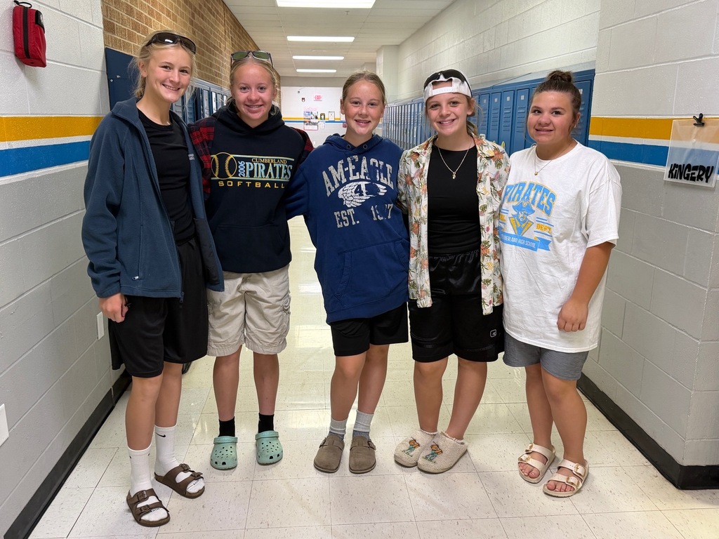 Five students are dressed like Adam Sandler. 