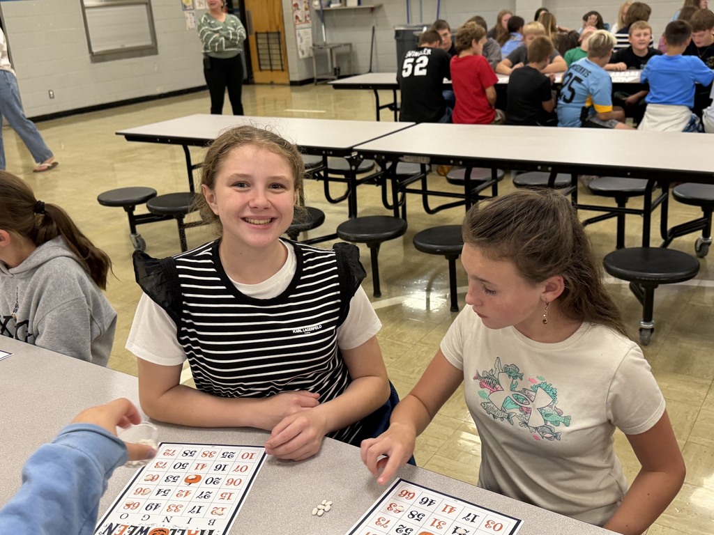 Two students are playing Bingo. 
