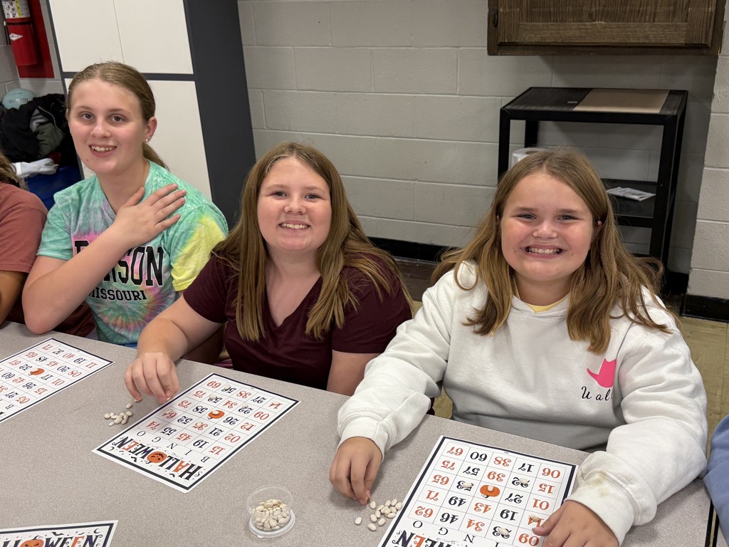 Three students are playing Bingo. 