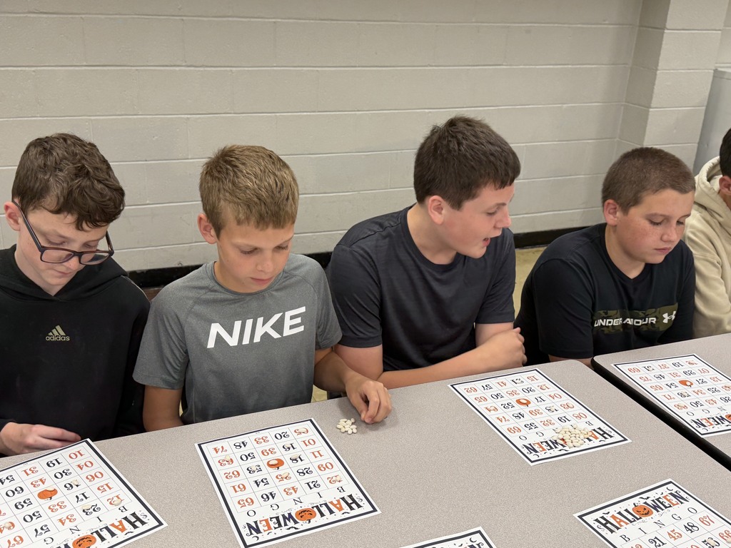 Four students are playing Bingo. 