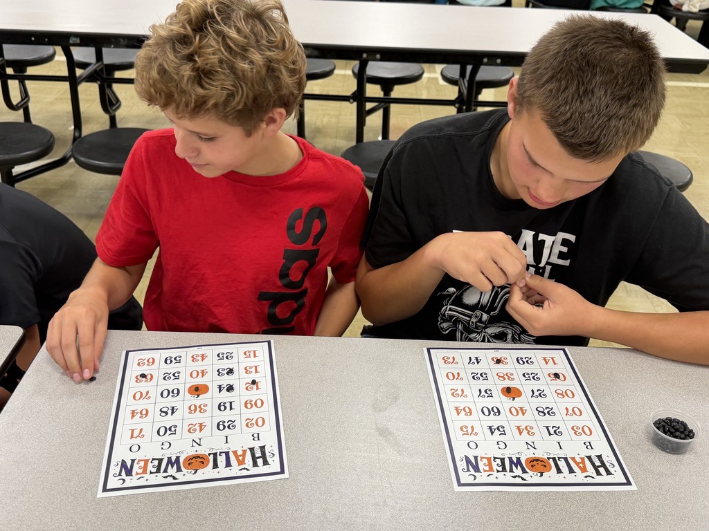 Two students are playing Bingo. 