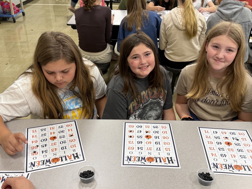 Three students are playing Bingo. 