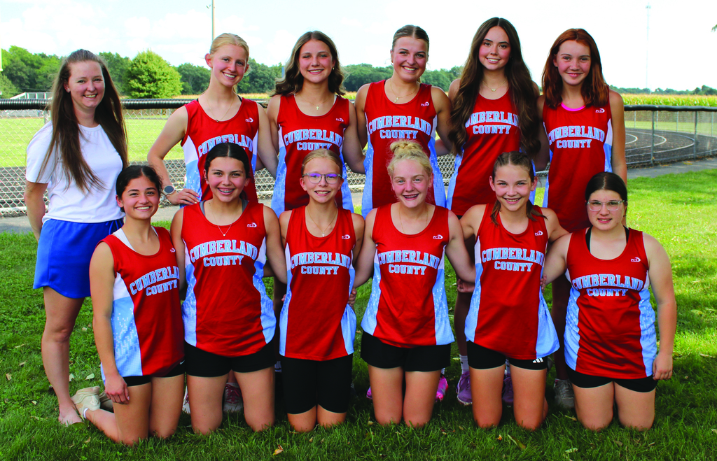 Pictured is one of the teams in uniform flanked by their coach. 