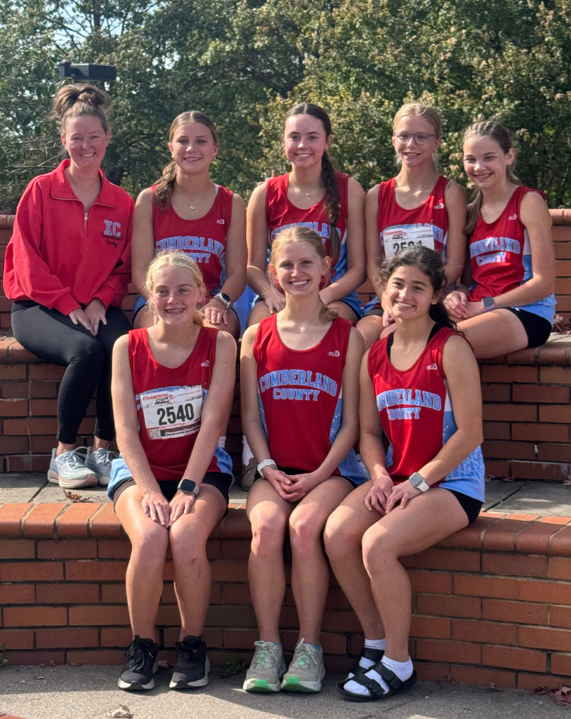 Pictured is the girls team with their coach. 