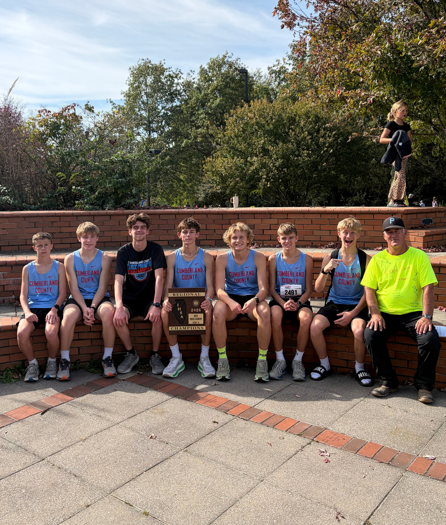 Pictured is the boys team with their coach. They are holding their plaque.