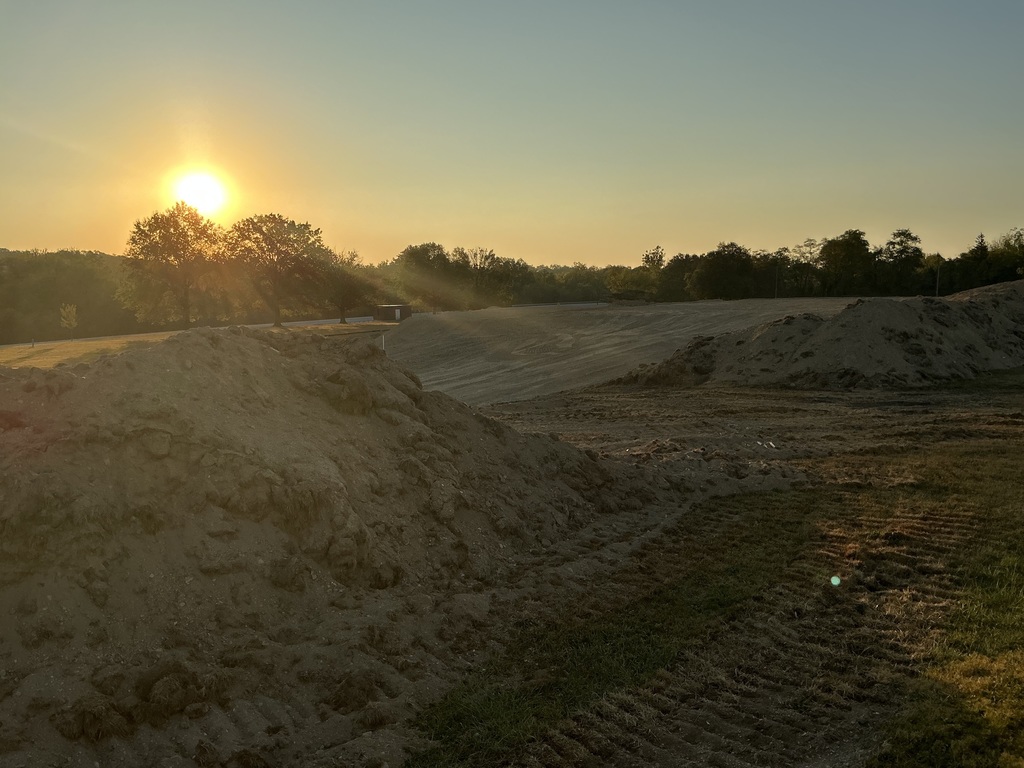 Sunrise over mountains of dirt