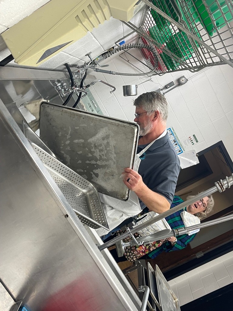 Mr. Drawbaugh washing all the dishes after breakfast